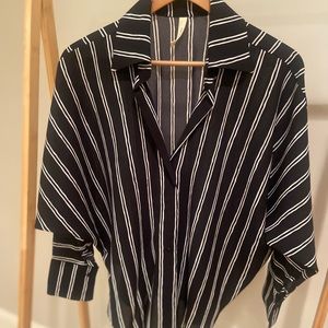 Brand new blouse with tags still on it runs very big.